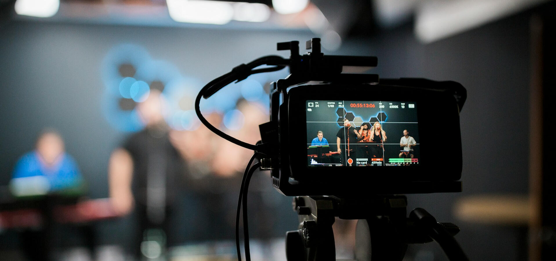 Camera in focus with blurred out stage in the background.